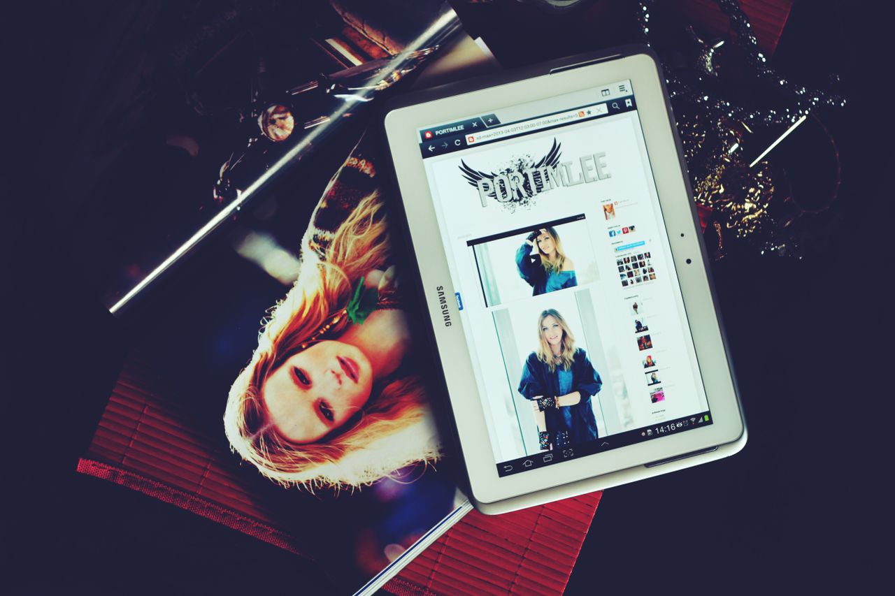project-02-a Stylish lifestyle photo showcasing a fashion magazine and tablet with a fashion website, ideal for e-commerce themes.